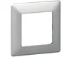 A single silver-colored wall plate with a square opening in the center, shown against a white background. Náhľad obrázku produktu