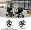 A family with two strollers on a paved street. Náhled obrázku produktu