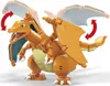 A toy model of the Pokémon Charizard, made of building blocks, posed to show movement. Voir les images du produit