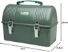 A green Stanley lunch box with silver clasps and a green handle, shown from the front with dimensions indicated. Podgląd zdjęcia produktu