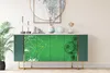 A green sideboard with a soccer field and soccer ball graphic on the doors, placed in a room with decorative items on top. Produktbild-Vorschau