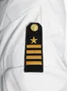A close-up of a uniform insignia on a white shirt. Produktbild-Vorschau