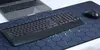 A laptop, keyboard, and mouse are placed on a large mousepad with a hexagonal pattern. Náhled obrázku produktu