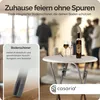 A round white table with a bottle of wine and two glasses, set in a blurred indoor party scene. Produktbild-Vorschau