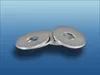 A stack of metal washers on a gradient blue background. Produktbild-Vorschau