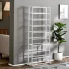 A white shoe rack stands in a room with a gray wall, a couch, and a potted plant. Produktbild-Vorschau