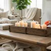 Candles in a wooden tray on a coffee table in a living room. Podgląd zdjęcia produktu