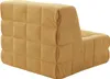 A single yellow floor chair with a quilted design is shown from a side-back angle against a white background. Náhled obrázku produktu