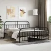 A bedroom scene with a black metal bed frame as the main focus. Podgląd zdjęcia produktu