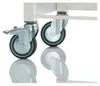 A close-up of two wheels on a rolling cart, with reflections on a white surface. Anteprima dell’immagine prodotto