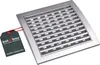 A silver rectangular ventilation grille with a dark gray tag attached by a red string, set against a white background. Náhled obrázku produktu