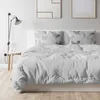 A bedroom scene with a bed made with butterfly-patterned bedding. Produktbild-Vorschau