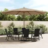 An outdoor patio scene with a table and chairs set up under a large umbrella. Voir les images du produit
