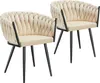 Two upholstered dining chairs with black metal legs, displayed on a white background.