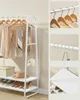 A white clothes rack with clothes, shoes, and accessories displayed. Náhled obrázku produktu