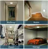 Collage of four images showing a LED wall light installed in different home settings: a hallway, stairs, a closet, and a garage. Produktbild-Vorschau