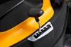 A close-up view of a lawnmower's gear shift lever and control panel. Produktbild-Vorschau