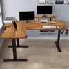 An L-shaped adjustable height desk with two monitors, a printer, and accessories. Voir les images du produit
