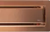 A close-up view of a copper-colored shower drain with the brand name 'Rea' visible. Produktbild-Vorschau