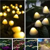 A collage of images showing mushroom-shaped solar garden lights in various outdoor settings, including close-ups and wider garden views. Produktbild-Vorschau