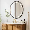 A bathroom vanity with a mirror above it. Produktbild-Vorschau