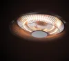 A close-up, low-angle shot of a ceiling-mounted patio heater with its heating elements illuminated. Anteprima dell’immagine prodotto