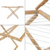 A collage of four images showing a collapsible bamboo drying rack from different angles. Anteprima dell’immagine prodotto