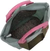 An overhead view of the inside of a blue-grey backpack with pink handles. Voir les images du produit