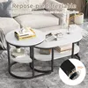 A living room scene with a sofa and a set of nesting coffee tables. Produktbild-Vorschau