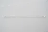 A long, thin, clear tube with small metallic elements inside, lying horizontally on a white background. Produktbild-Vorschau