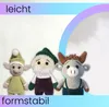 Three crocheted stuffed toys: an elf, Santa Claus, and a bull, are displayed against a white background with a colorful gradient overlay on the right. Text labels 'leicht' and 'formstabil' are present. Produktbild-Vorschau