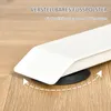 Close-up of the adjustable foot of a white desk on a wooden floor. Podgląd zdjęcia produktu