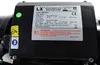 A close-up of a black hydromassage bathtub pump with a label displaying technical specifications and warnings. Produktbild-Vorschau