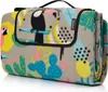A folded picnic blanket with a tropical pattern. Produktbild-Vorschau