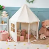 A child's play tent filled with soft blocks and balls, with a large teddy bear and a stool nearby. Produktbild-Vorschau