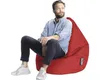 A man is sitting on a red beanbag chair. Náhled obrázku produktu