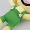 Close-up of a plush toy's green overalls and yellow body. Produktbild-Vorschau