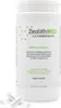 A white bottle of Zeolith MED Detox Kapseln with two capsules in the foreground. Produktbild-Vorschau