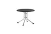 A round, black-topped table with silver legs is shown against a white background. Produktbild-Vorschau