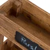 A close-up view of a wooden planter box with a chalkboard label. Produktbild-Vorschau