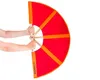 Hands holding a red and orange fan-like object against a white background. Produktbild-Vorschau