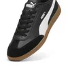 A close-up shot of a black Puma sneaker with a white stripe and a gum sole. Produktbild-Vorschau