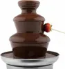 A close-up of a chocolate fountain with a strawberry dipped in chocolate. Podgląd zdjęcia produktu