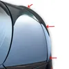 A close-up view of a black car spoiler attached to the rear of a car. Náhled obrázku produktu