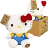 Two Hello Kitty plush toys, one in the foreground and one in a box in the background. Anteprima dell’immagine prodotto