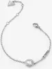 A silver bracelet with a clear stone and the brand name on a white background. Anteprima dell’immagine prodotto