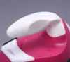 Close-up of a pink and white handheld steam iron. Produktbild-Vorschau
