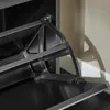 Close-up of the mechanism of a shoe cabinet flap. Produktbild-Vorschau