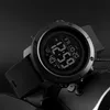 A close-up shot of a black digital watch with a black textured strap against a dark background. Produktbild-Vorschau