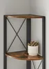 A close-up view of a corner shelf unit with a plant on one of the shelves. Náhled obrázku produktu